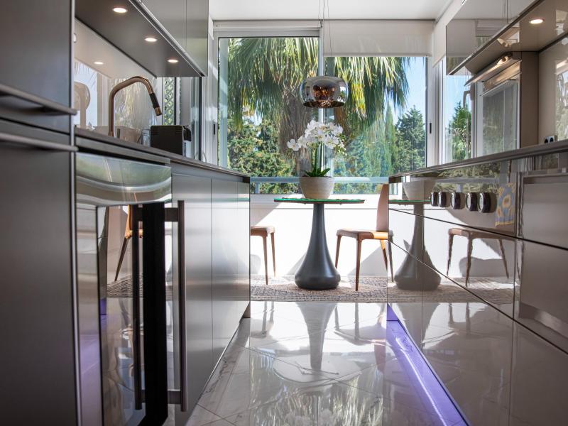 Kitchen detail with dining table and floor-to-ceiling glazing
