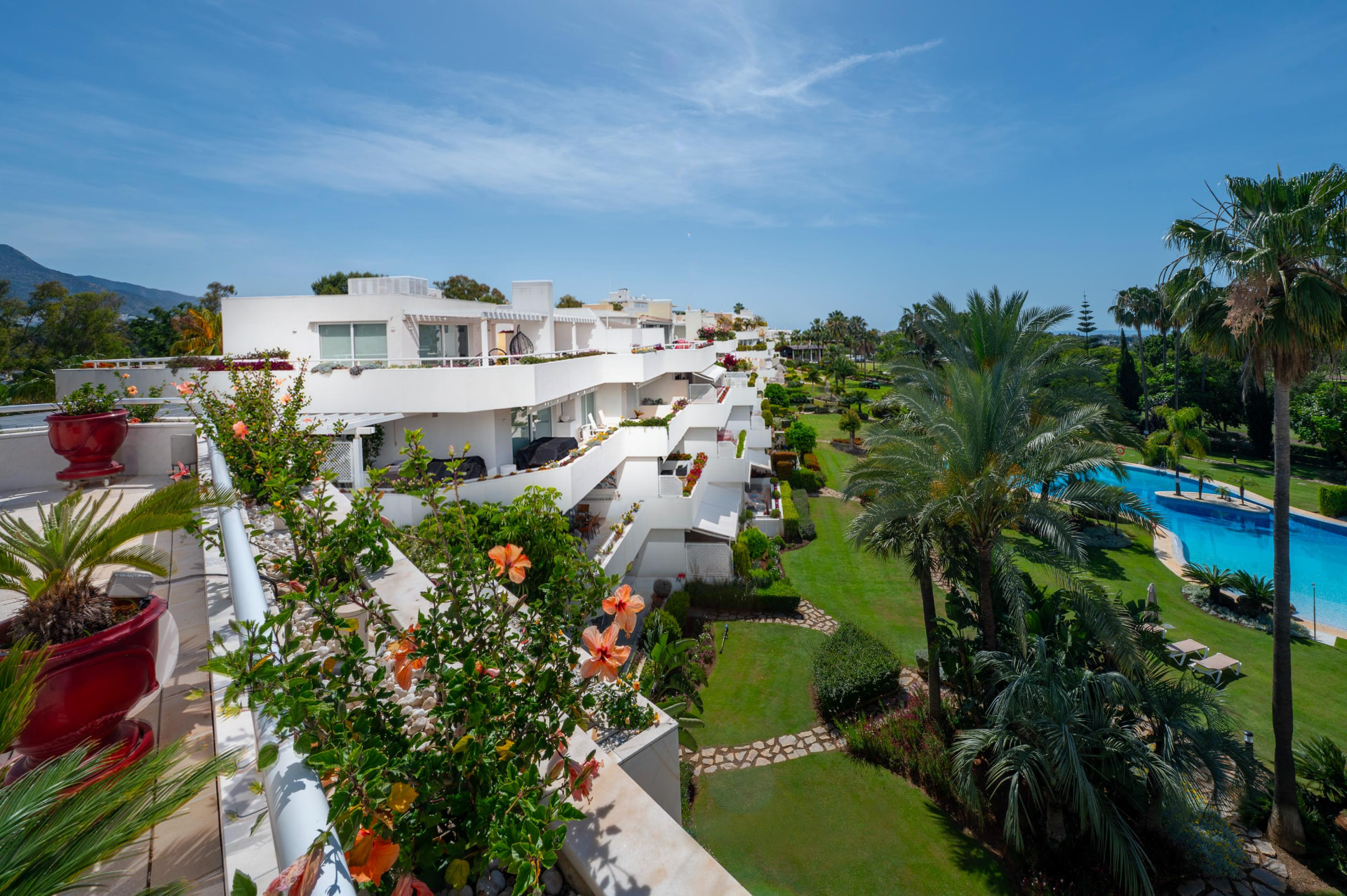 Terraced white architecture of Los Granados Golf above the gardens