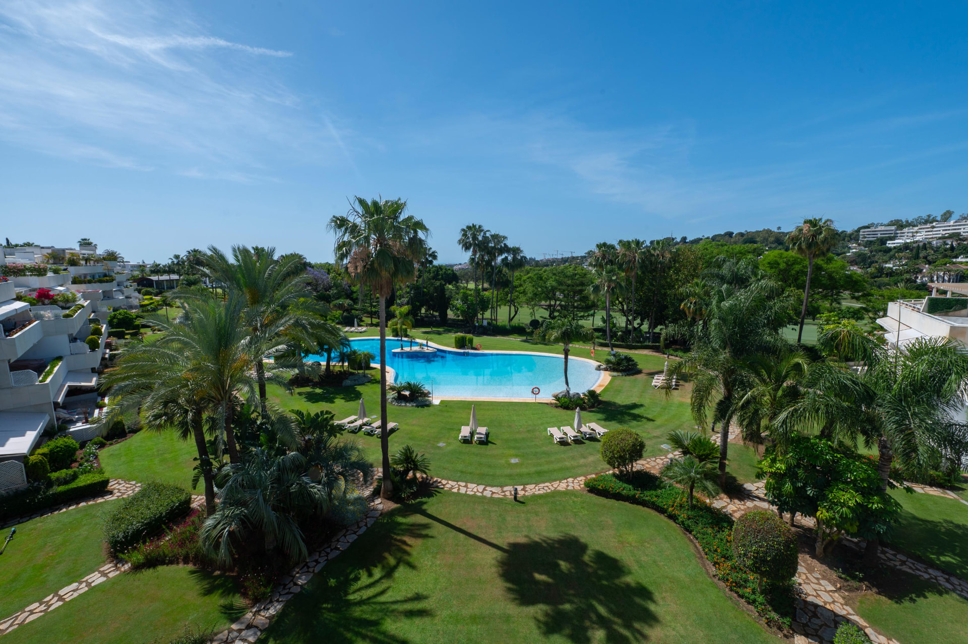 Los Granados Golf gardens and lagoon pool seen from the penthouse terrace