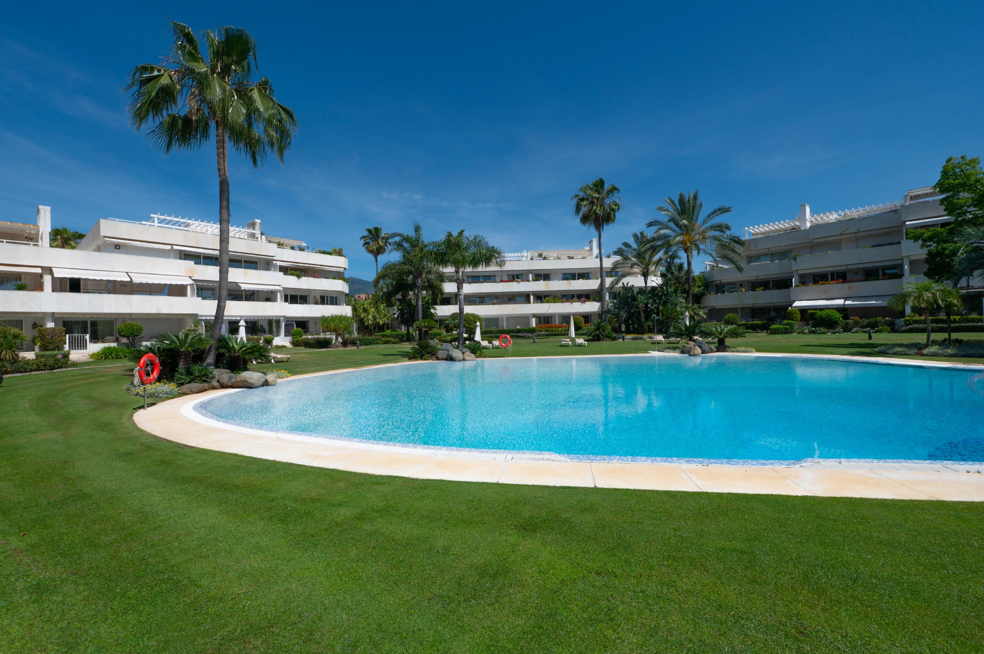 Lagoon-shaped community pool and lawns